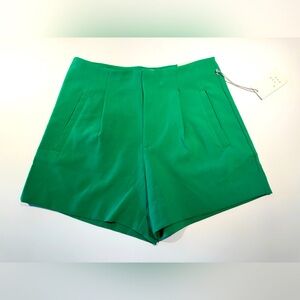 Bright green high-waisted shorts